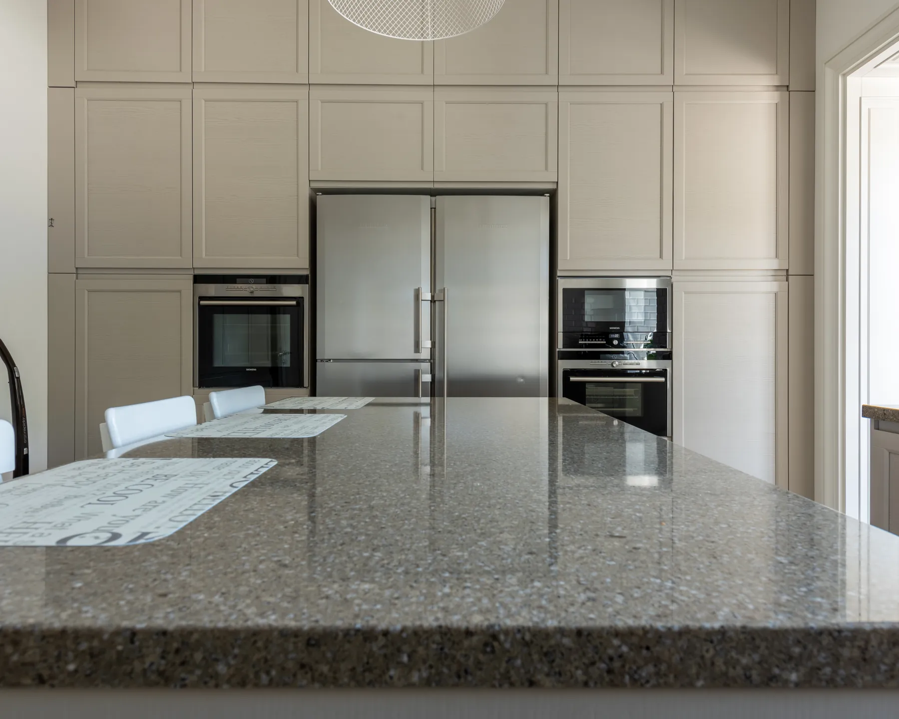 Placeholder before image of a speckled kitchen countertop.