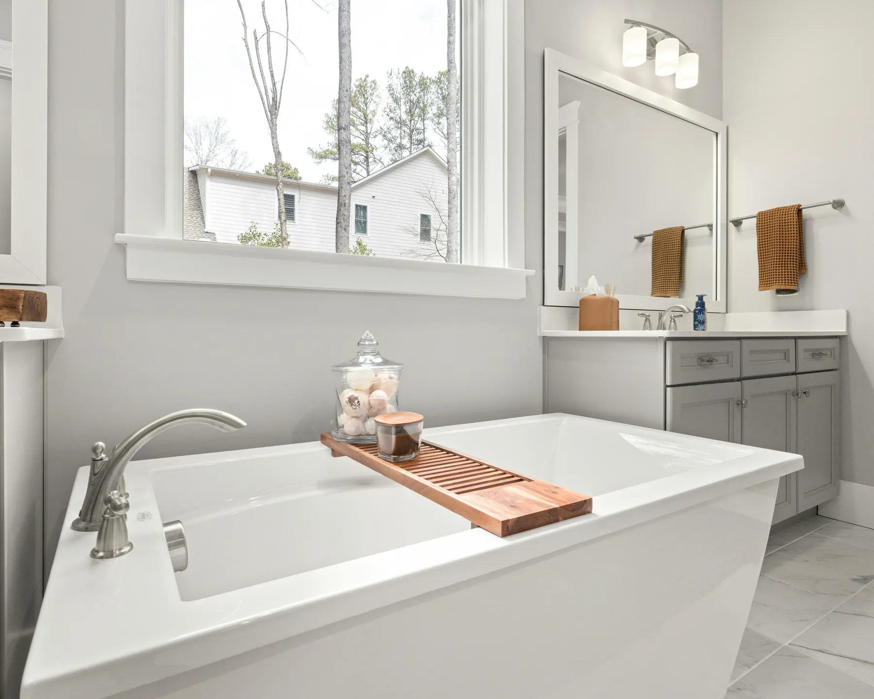 Placeholder after photo of a soaking tub in a finished bathroom.