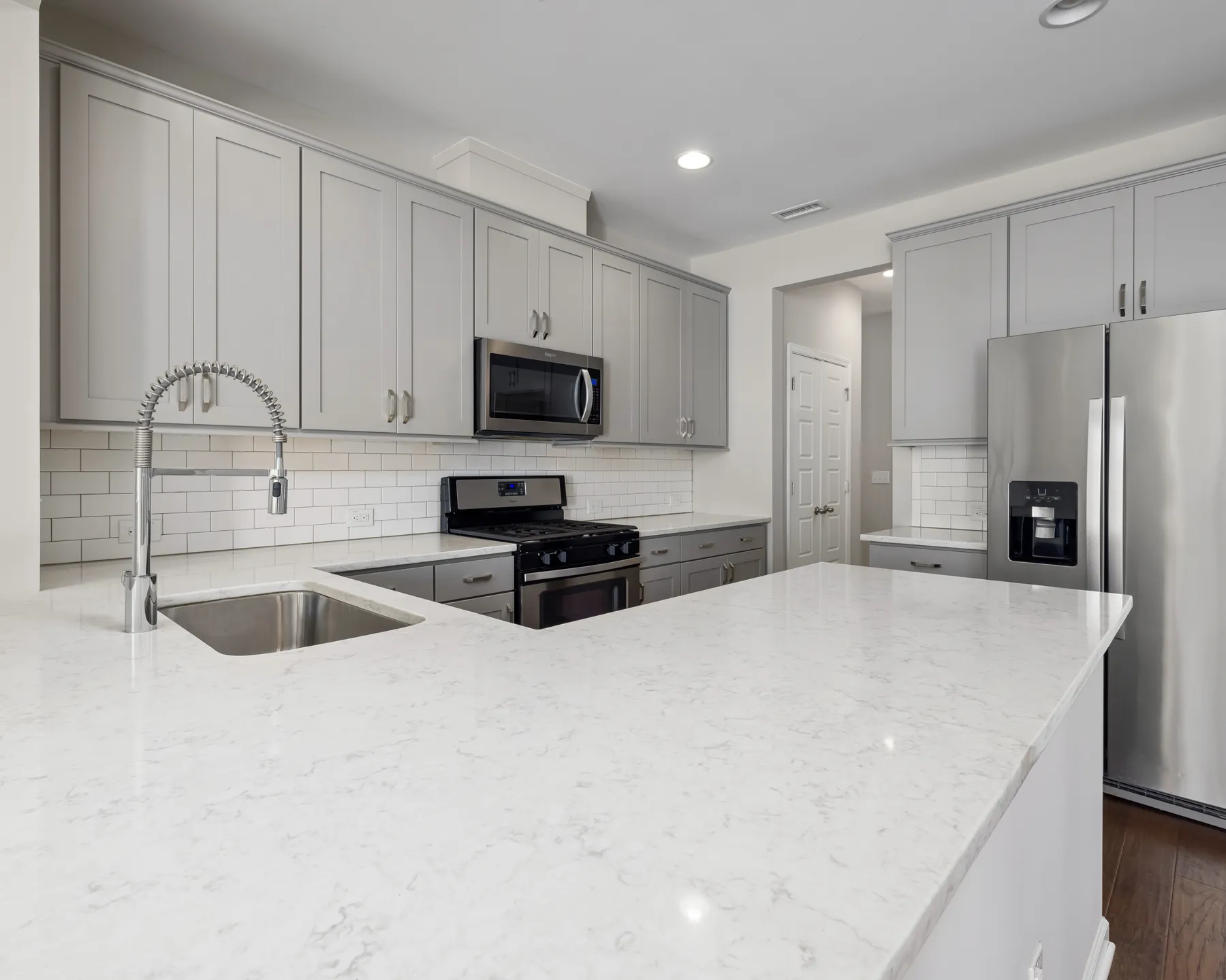 Placeholder image of a white kitchen island countertop and sink.